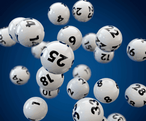 Numbered lottery balls hang in the air.