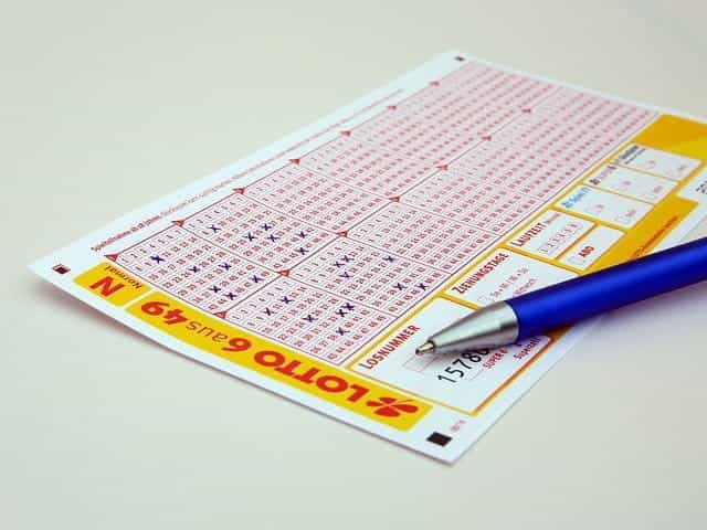 Lottery ticket and pen.