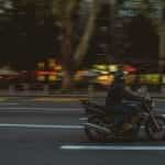 A man rides a motorcycle through the streets of Beograd, Serbia.