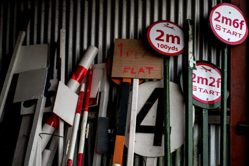 Racecourse signs and signposts in storage.