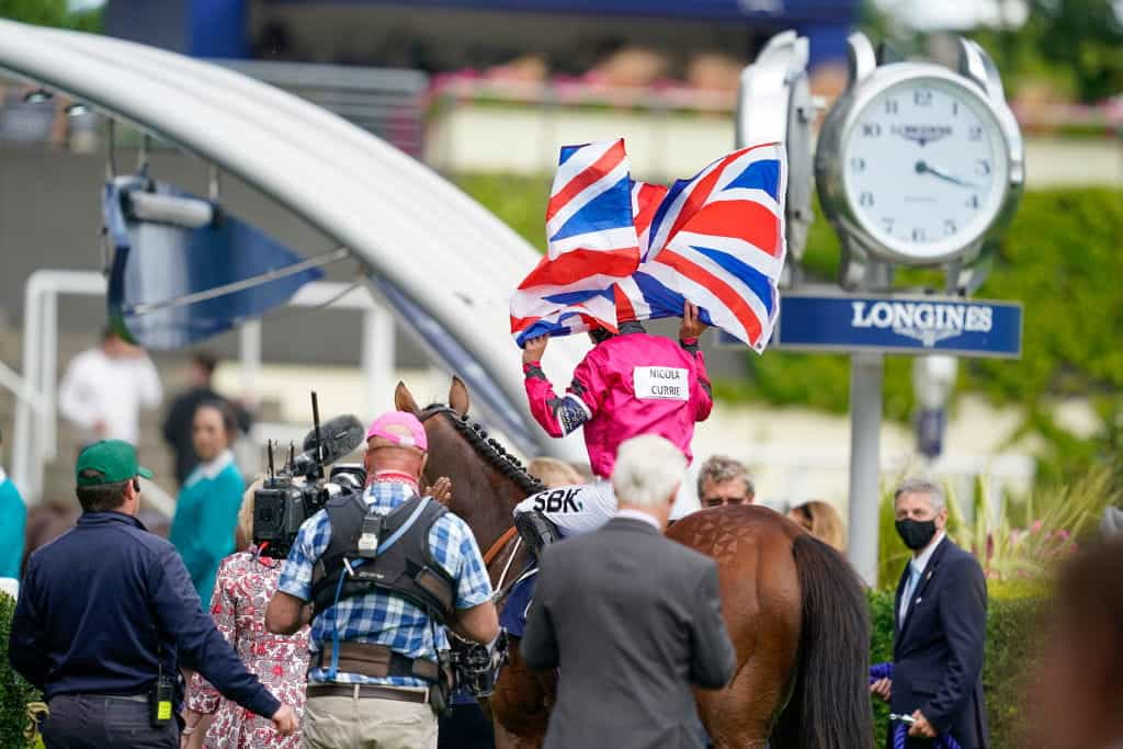 Nicola Currie celebrates after riding a winner at the 2021 Dubai Duty Free Shergar Cup.?