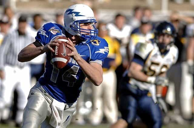 An American football player playing the quarterback position.