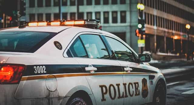 A police car parked with its lights on.