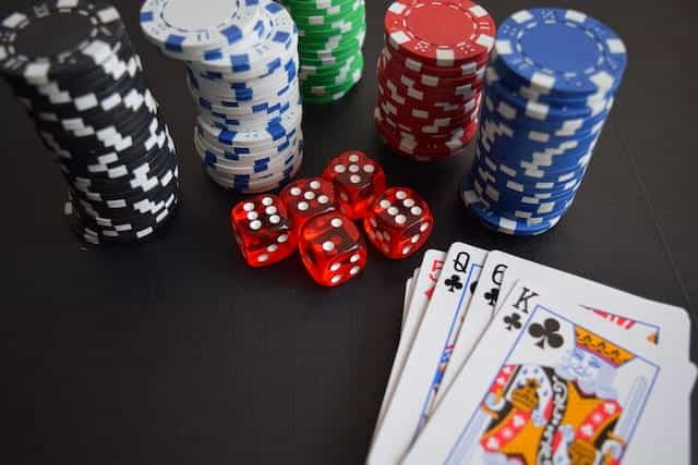 Poker chips, playing cards and dice.