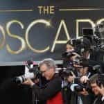 Photographers cover the red-carpet arrivals to the 85th Annual Academy Awards.