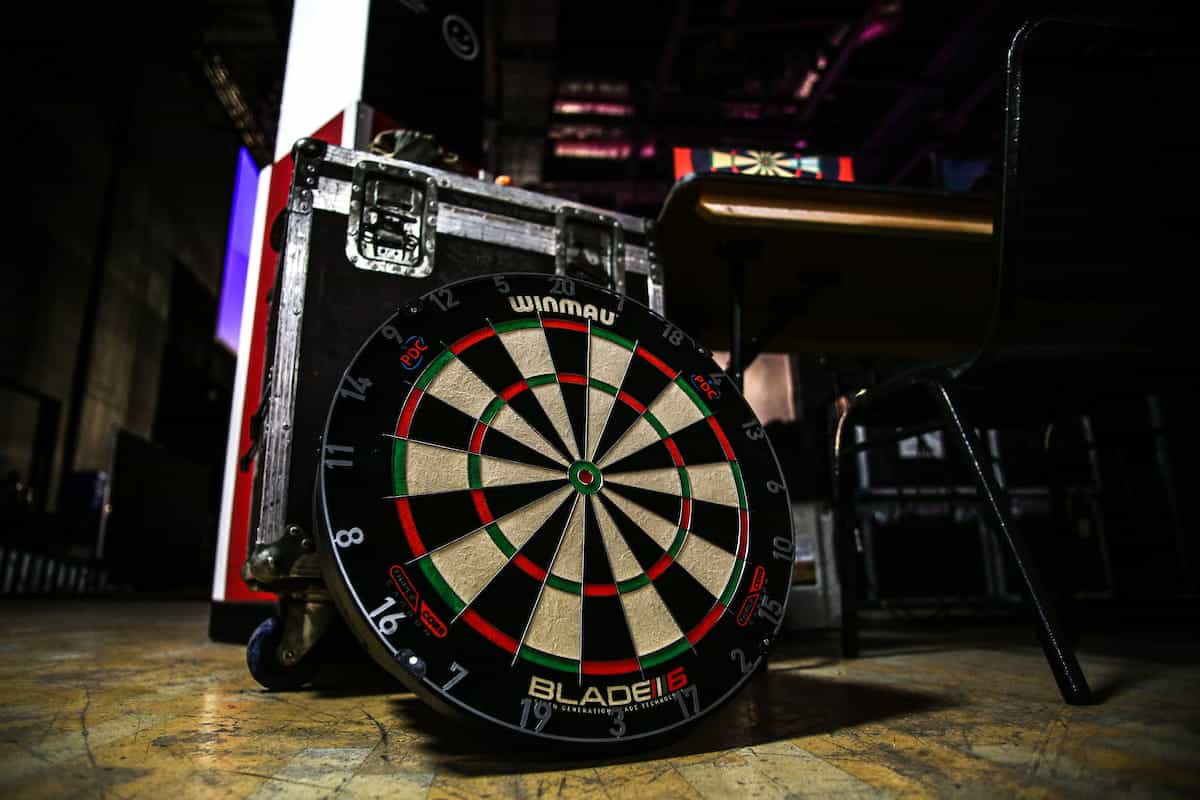 A dart board placed backstage amongst equipment at a PDC event..