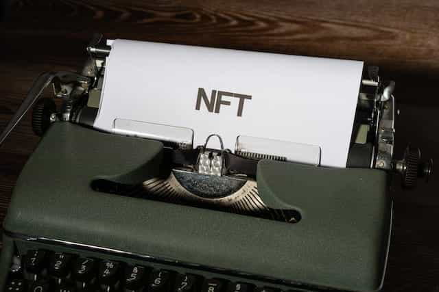 A typewriter with NFT written on paper.