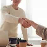 Two colleagues shake hands.