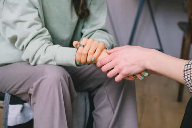 A therapist comforting a patient.