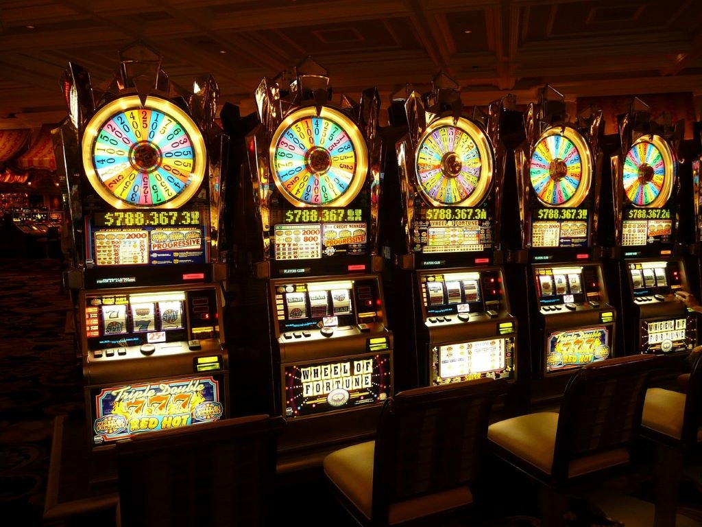 An image showing slot machinesat a casino.